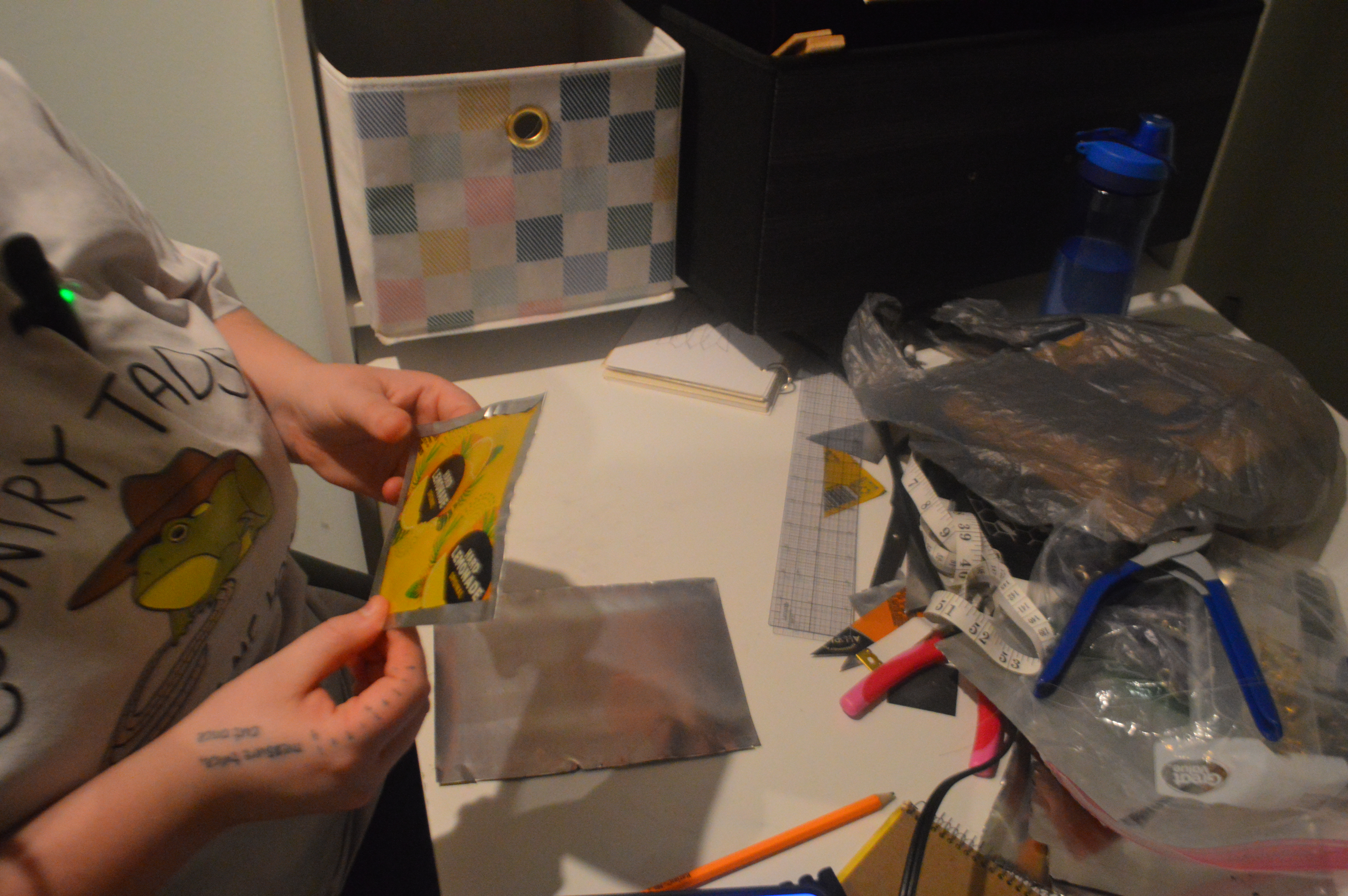 Bee Mangine working with aluminum during the garment-making process.