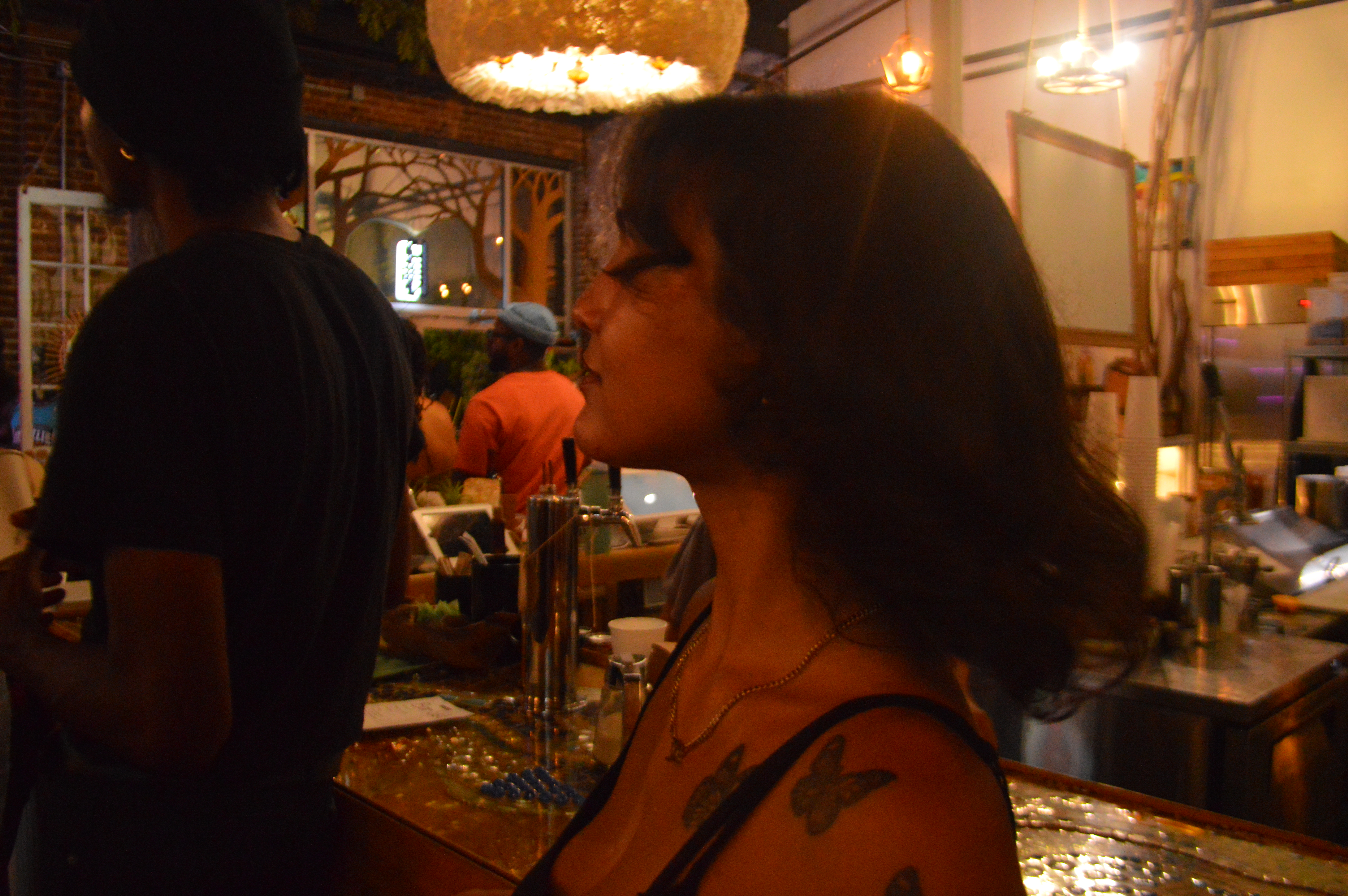 Jade Gomez watches a performance from the audience.