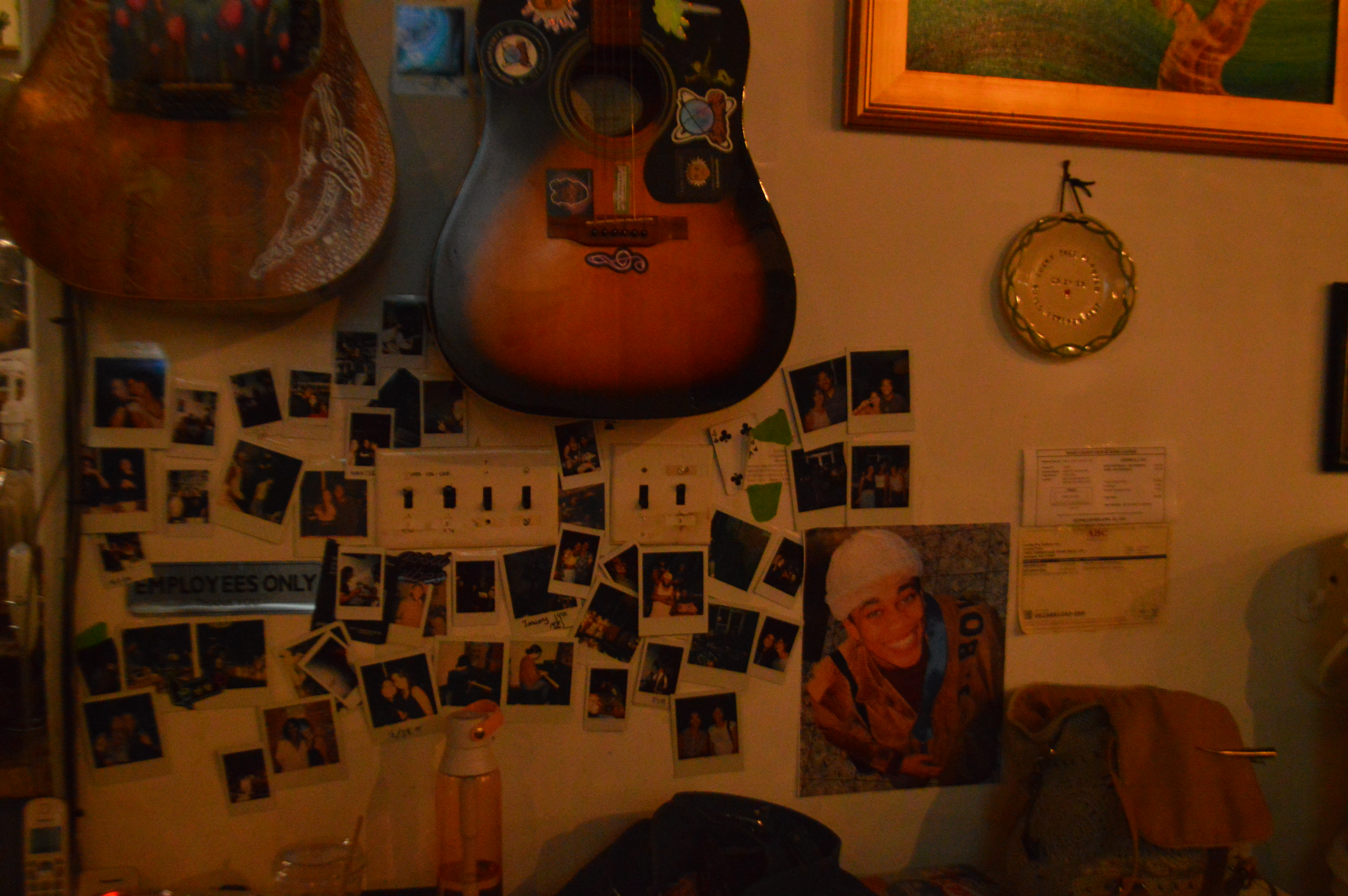 Guitars, photographs and found objects cover a wall inside Lucky Tree.
