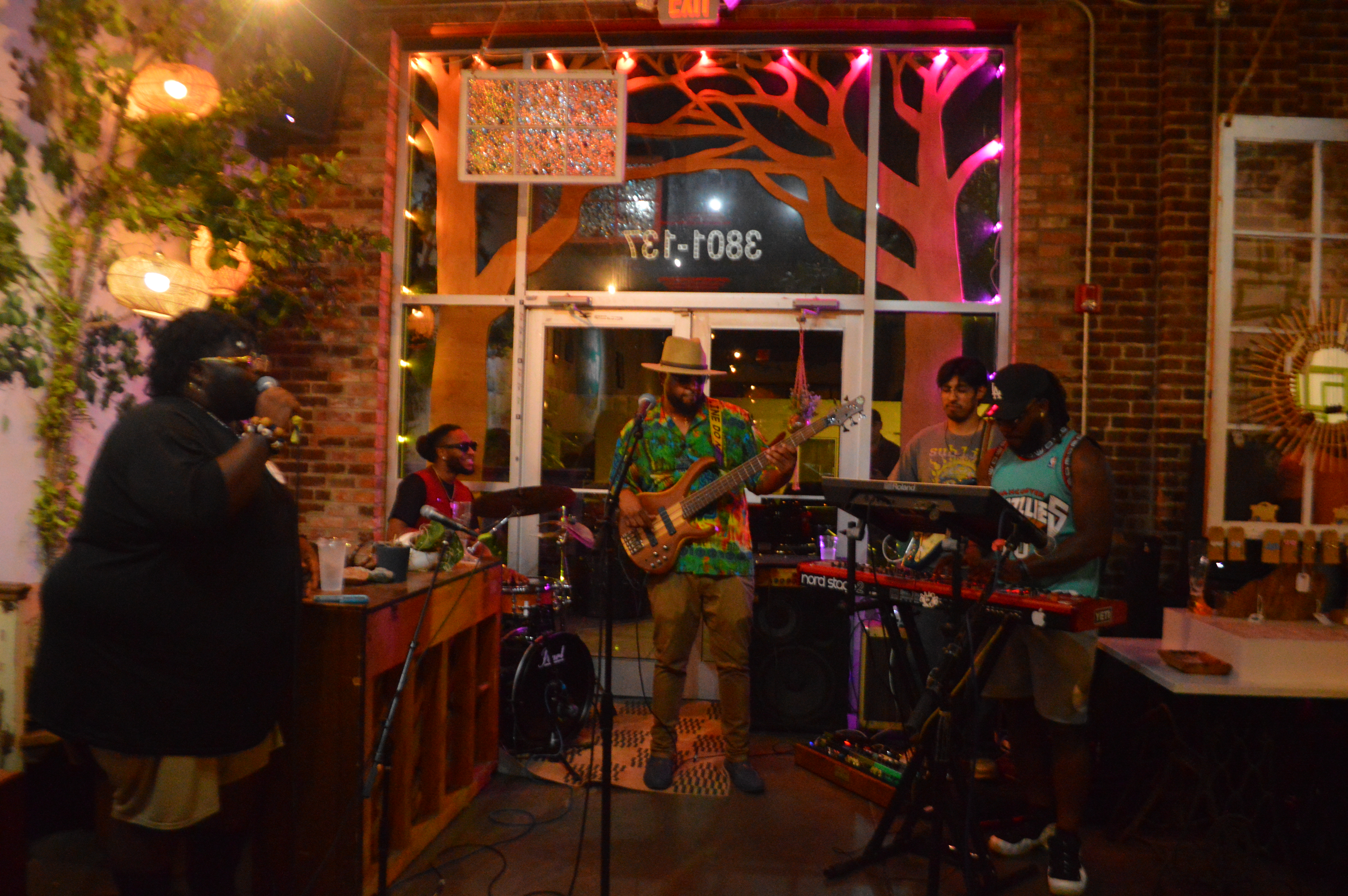 Musicians performing together during Live Mic at Lucky Tree.